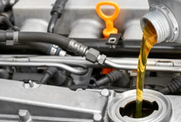 New oil being poured into a car engine.